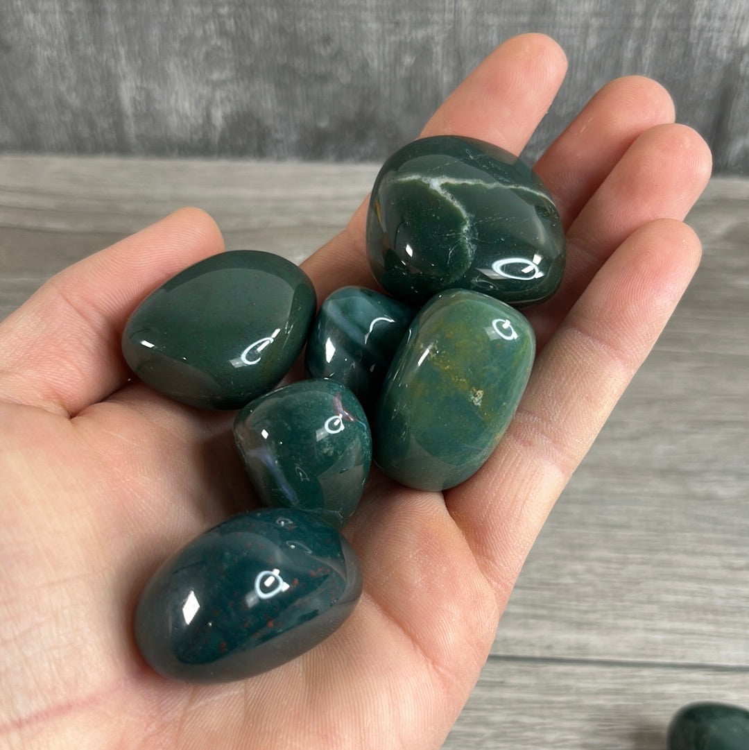 Bloodstone tumbled stones wholesale - smooth green and red healing crystals by the pound.