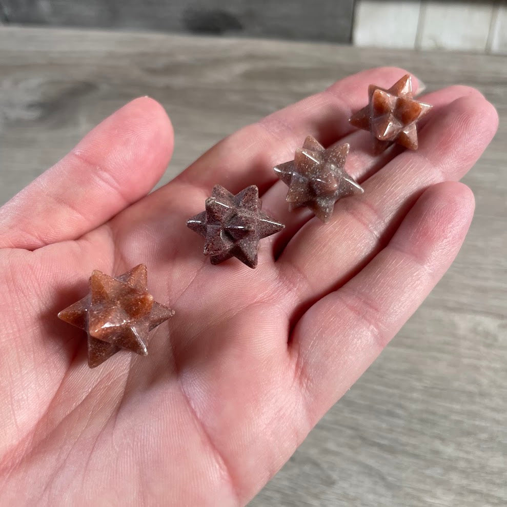 Twelve point double Merkaba star carved from red aventurine gemstone