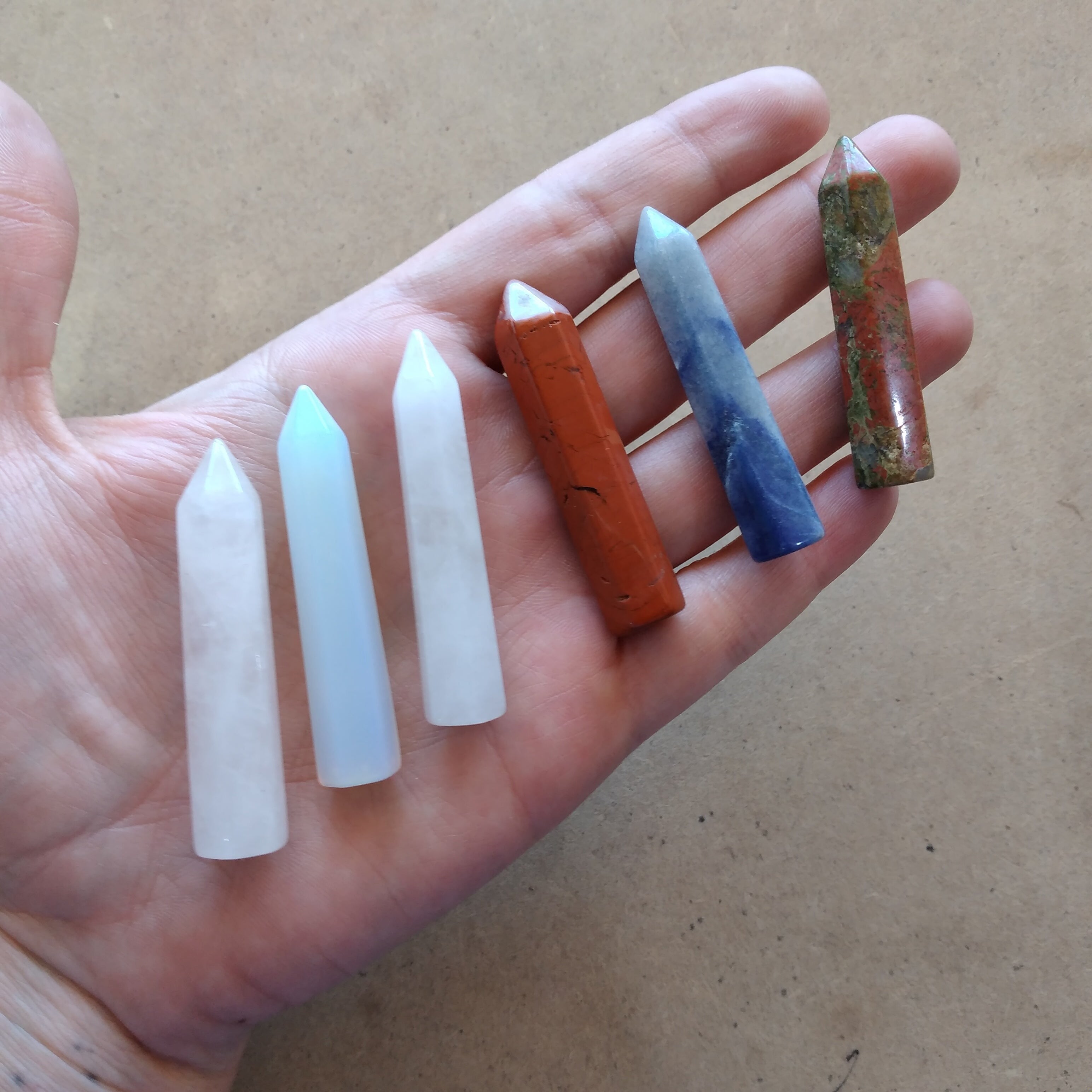 5 assorted cyrtals in hand