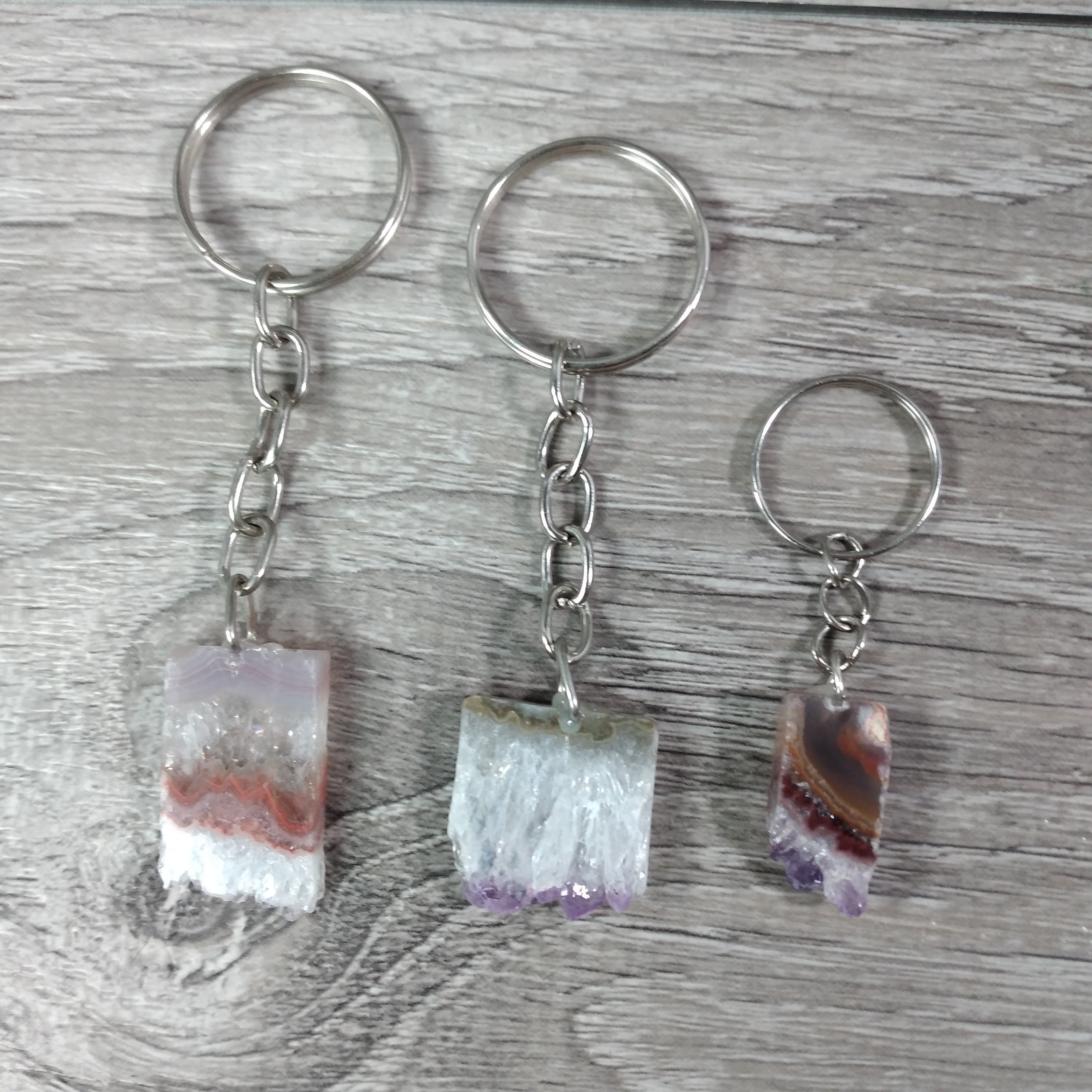 Assorted purple amethyst druze keychains for metaphysical shops
