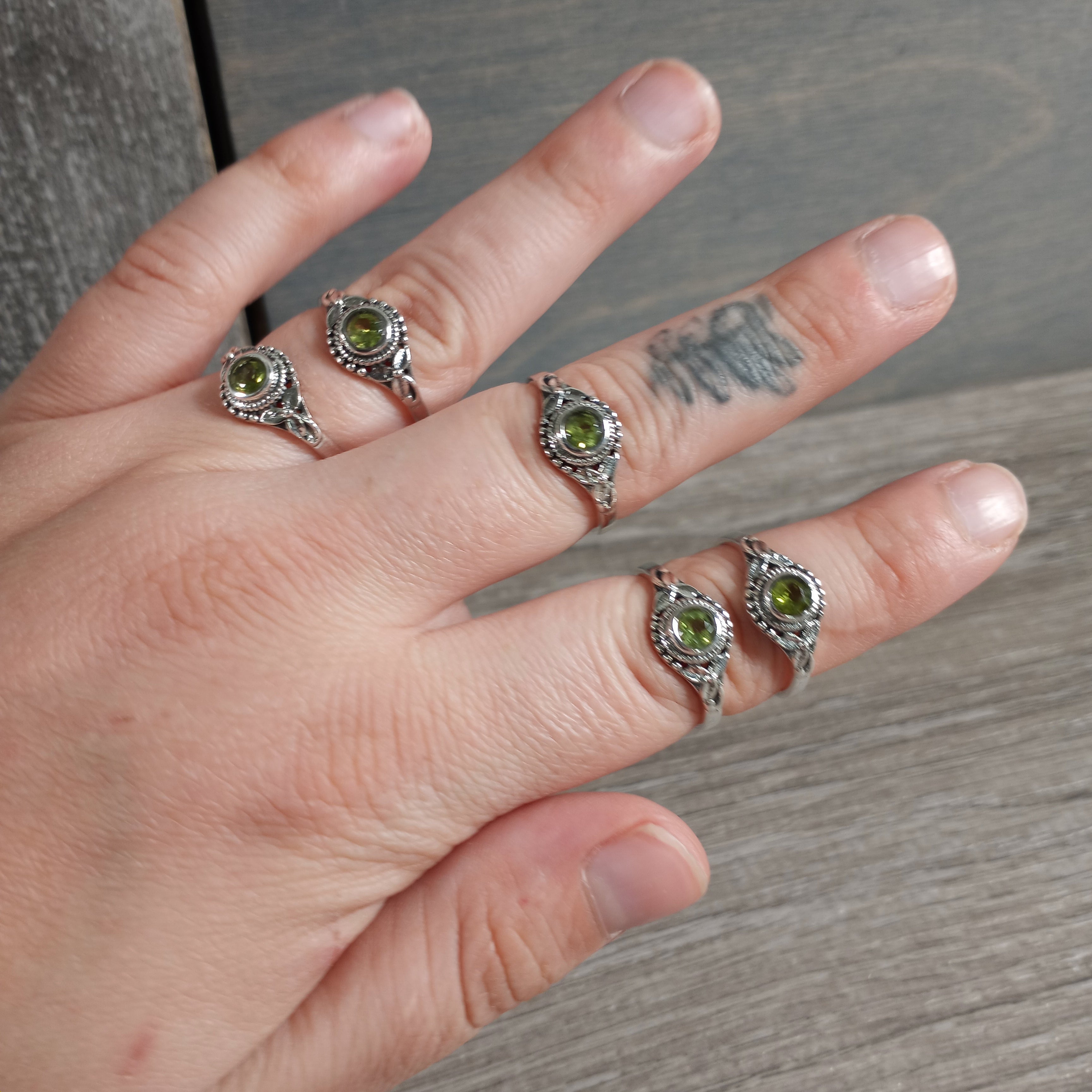 Sterling Silver ring with Hippie Leaf band and peridot center stone