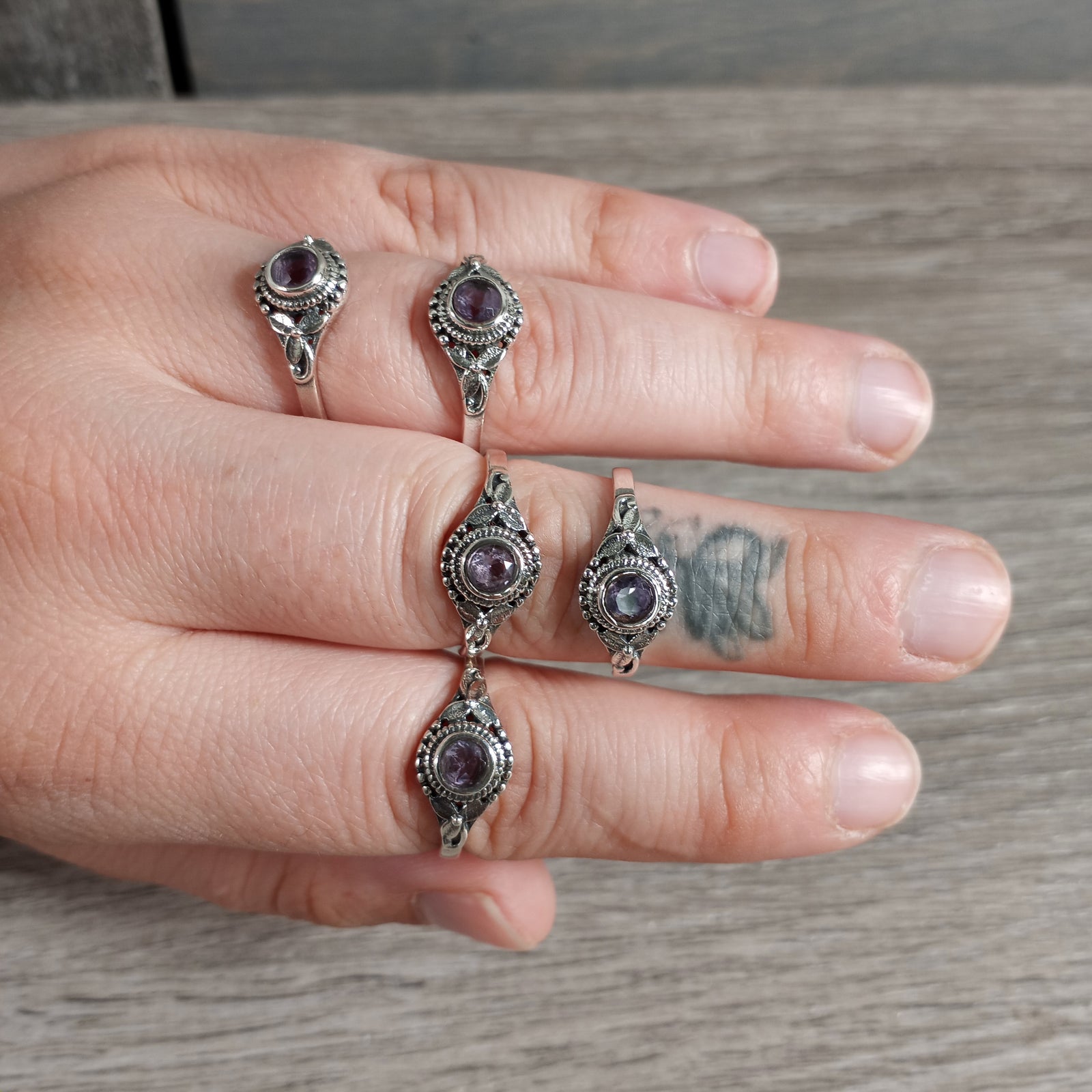 Sterling Silver ring with Hippie Leaf band and amethyst center stone