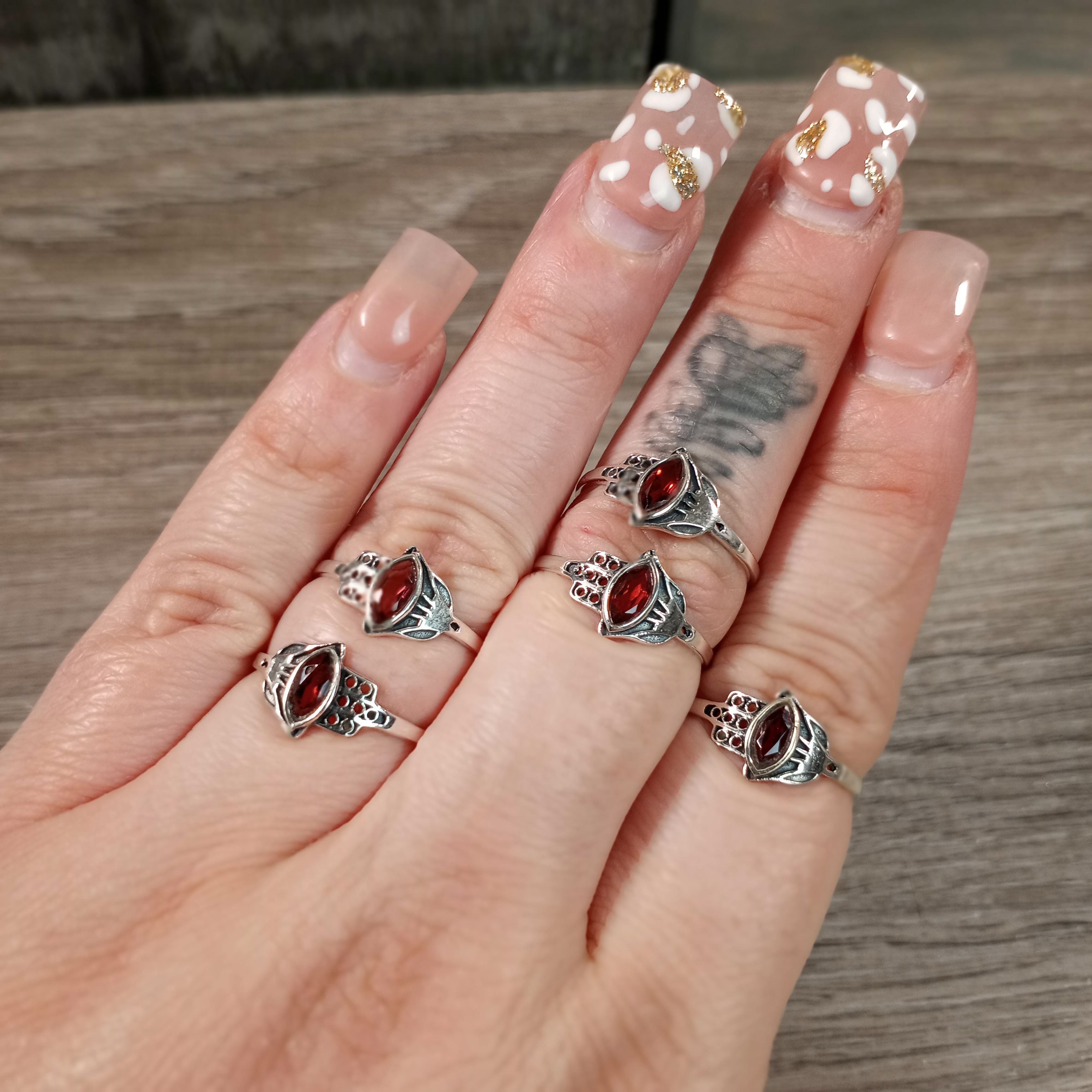 Sterling Silver Ring with Hamsa Hand setting and ruby center stone