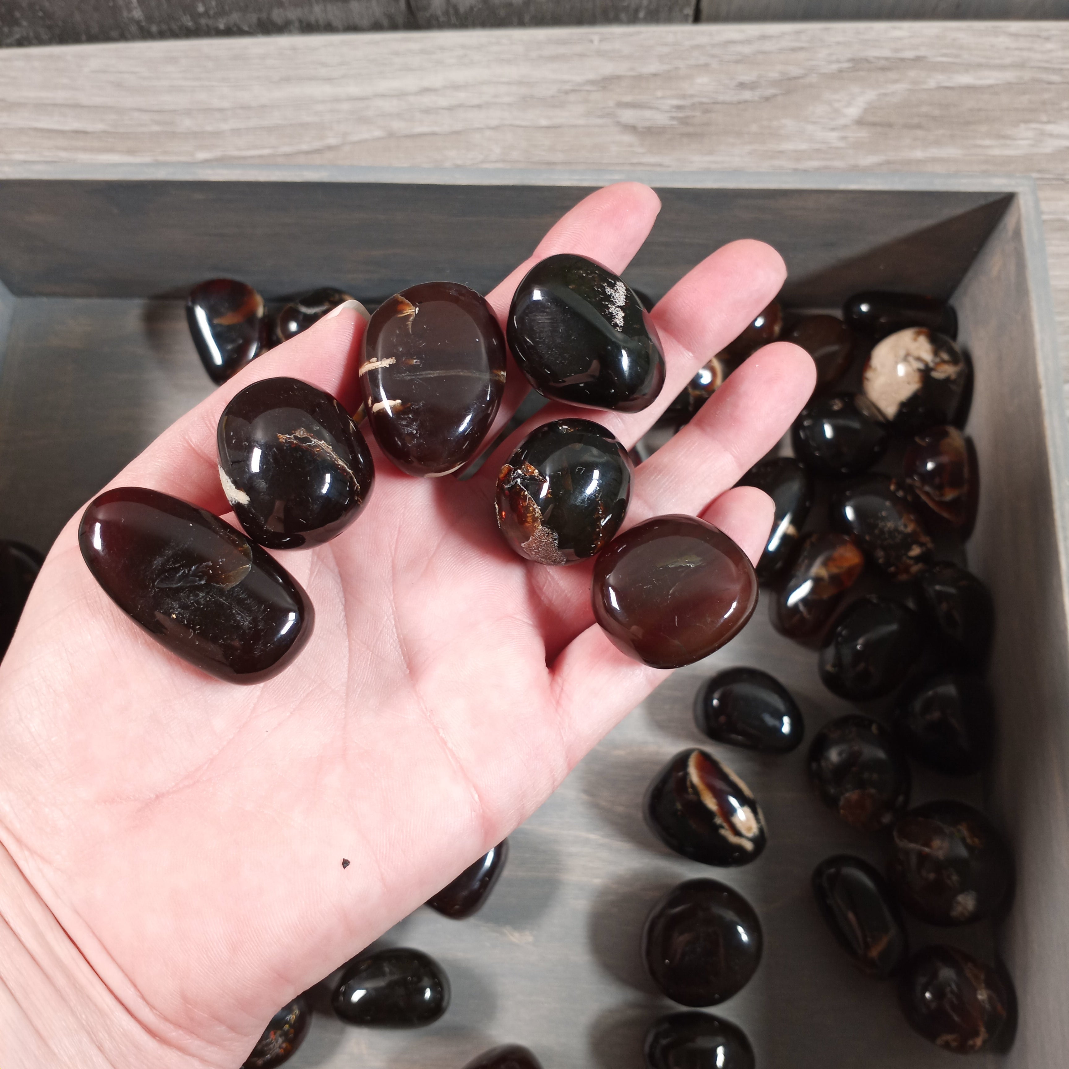 Tumbled black amber stones for metaphysical use wholesale