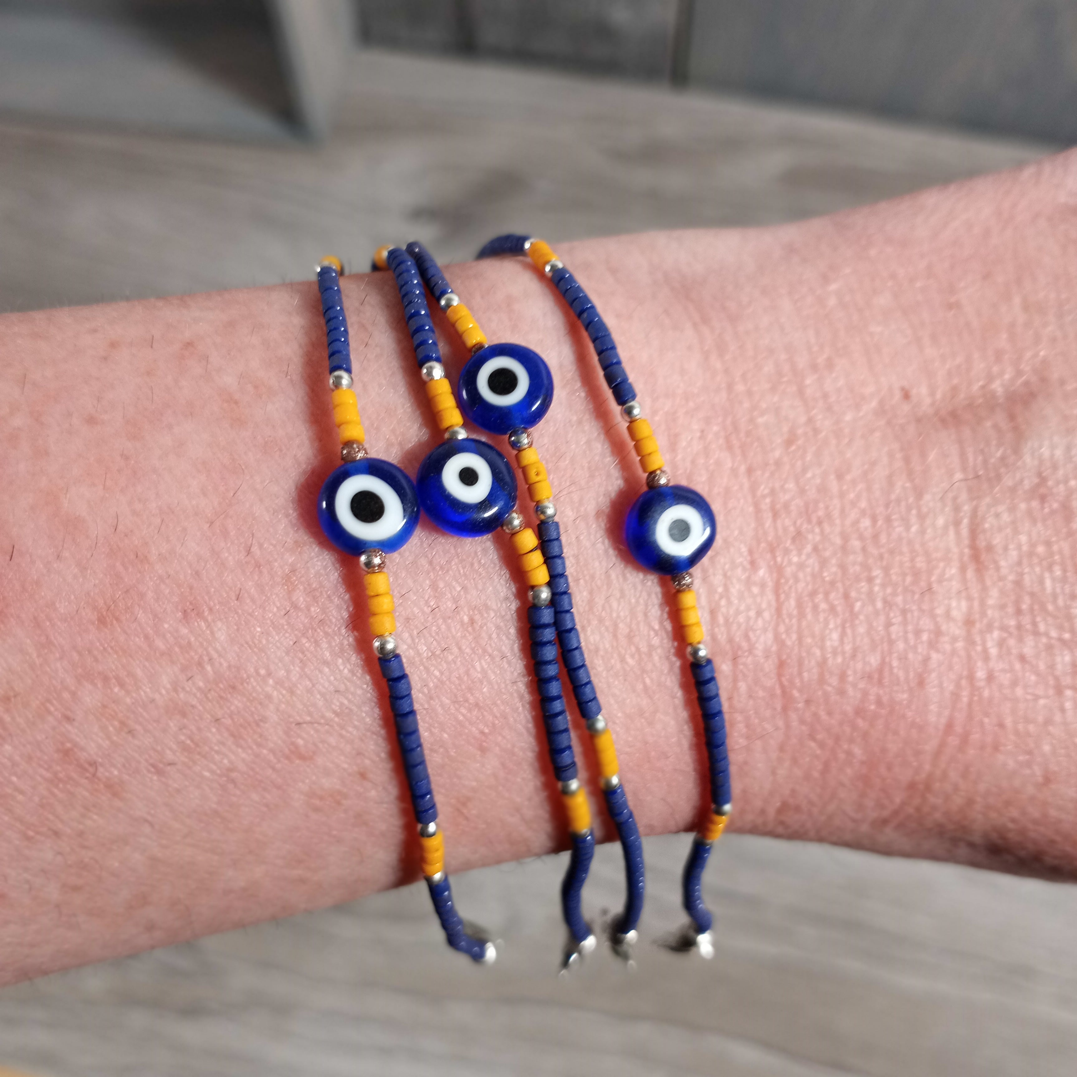 Wooden Beaded Bracelet with Lobster Claw Clasp and Evil Eye Charm