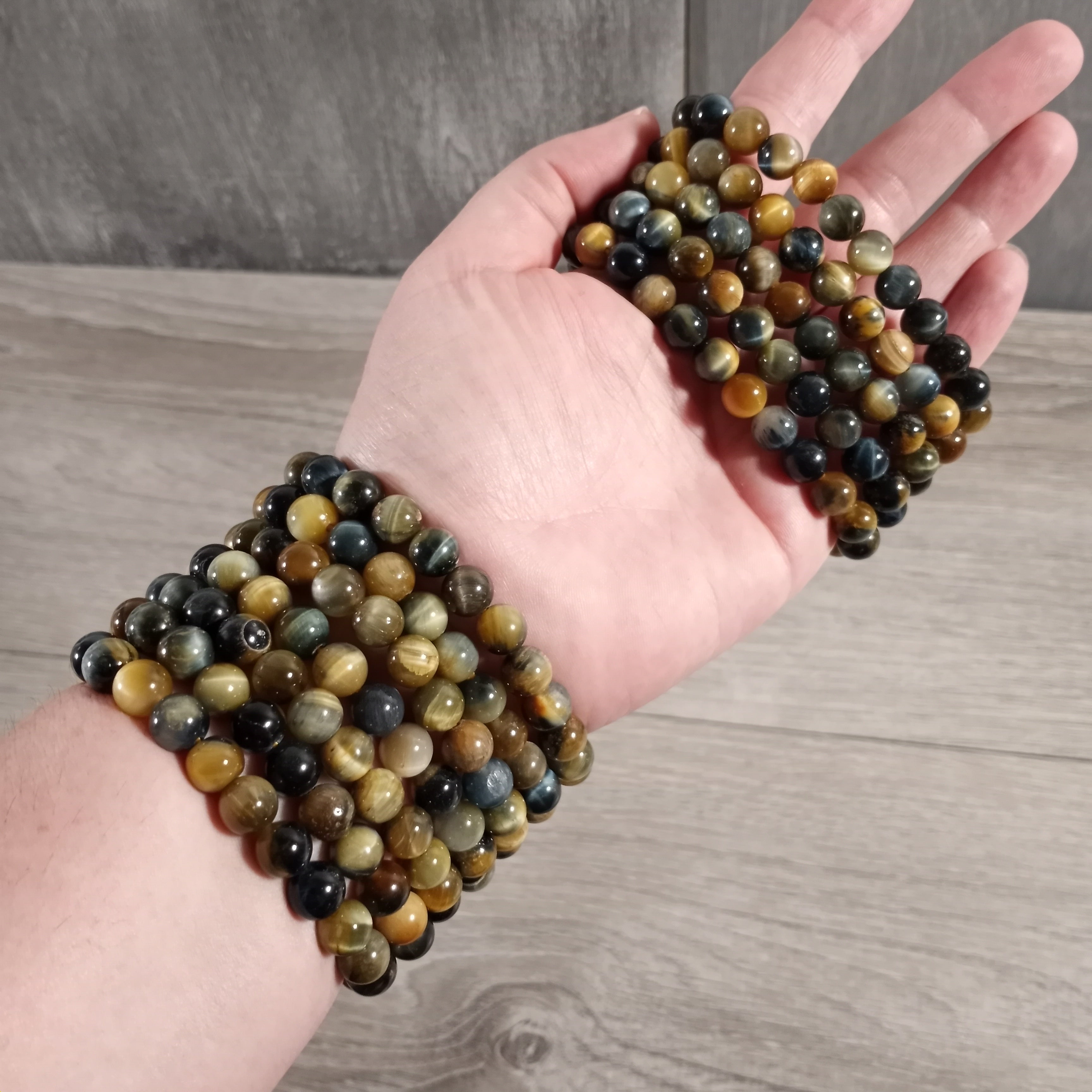 Blue and Yellow Tiger Eye stacking baracelets for yoga studios