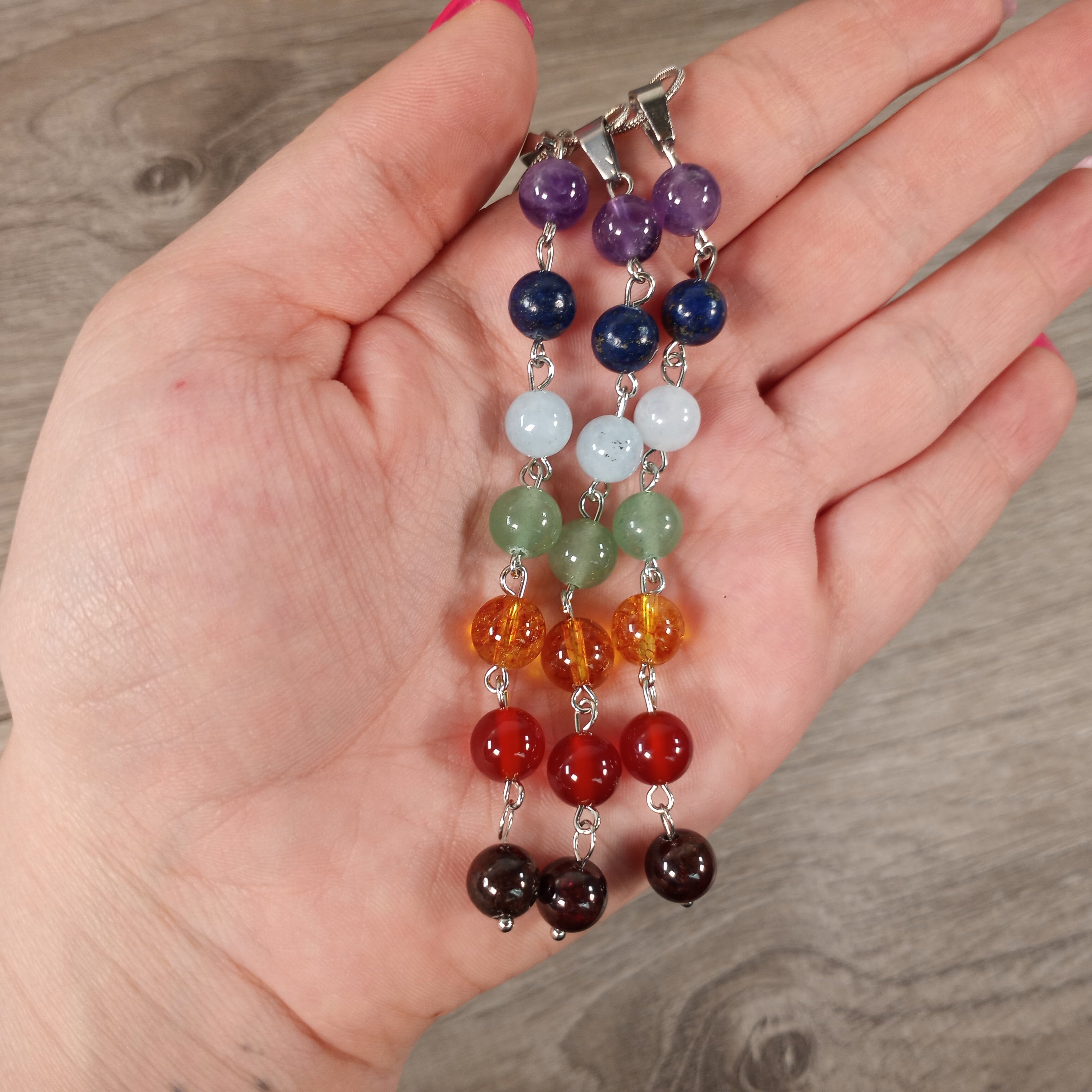 Close-up of 8mm beads on Chakra Drop Necklace showcasing seven chakra colors.