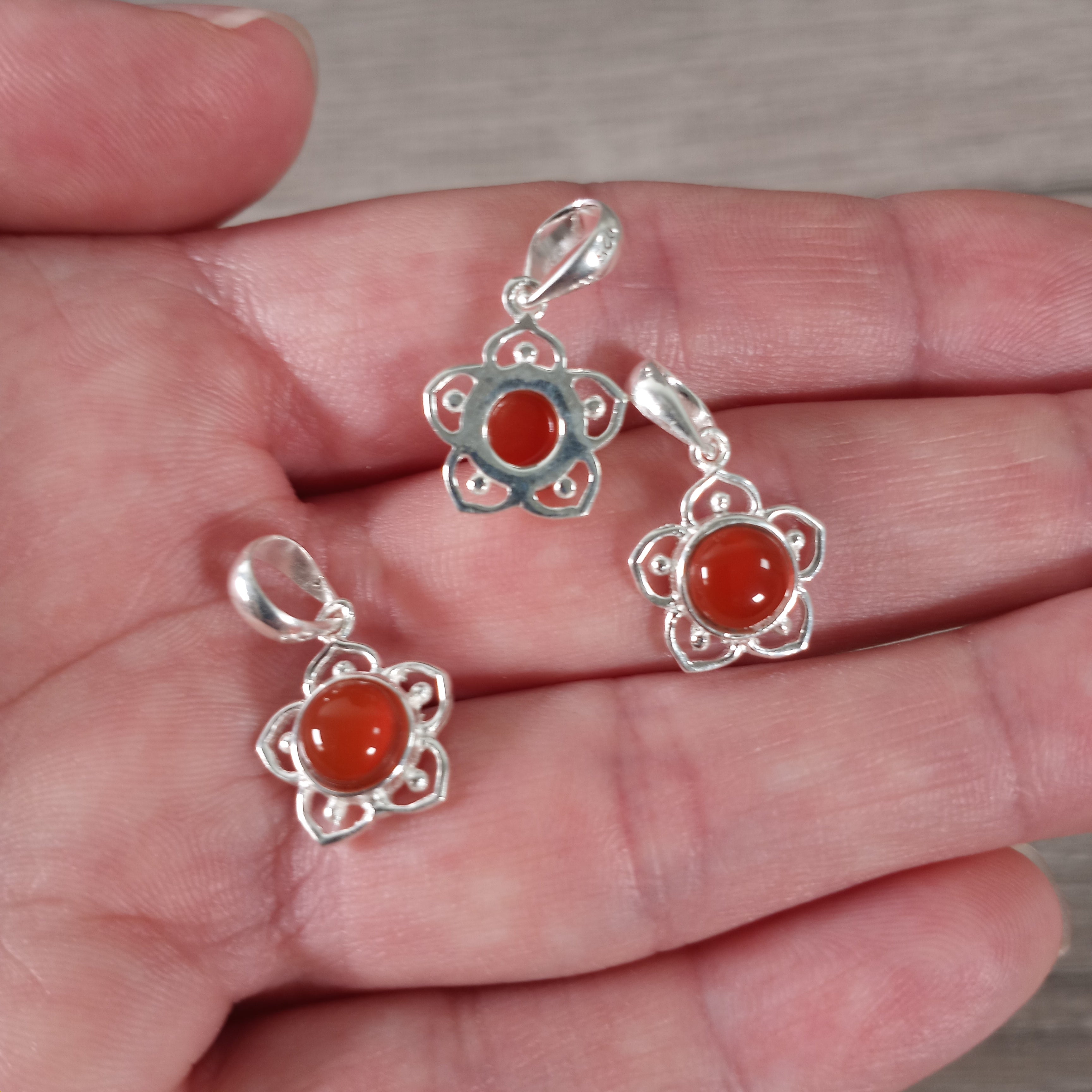 carnelian flower charm made from sterling silver and natural gemstones