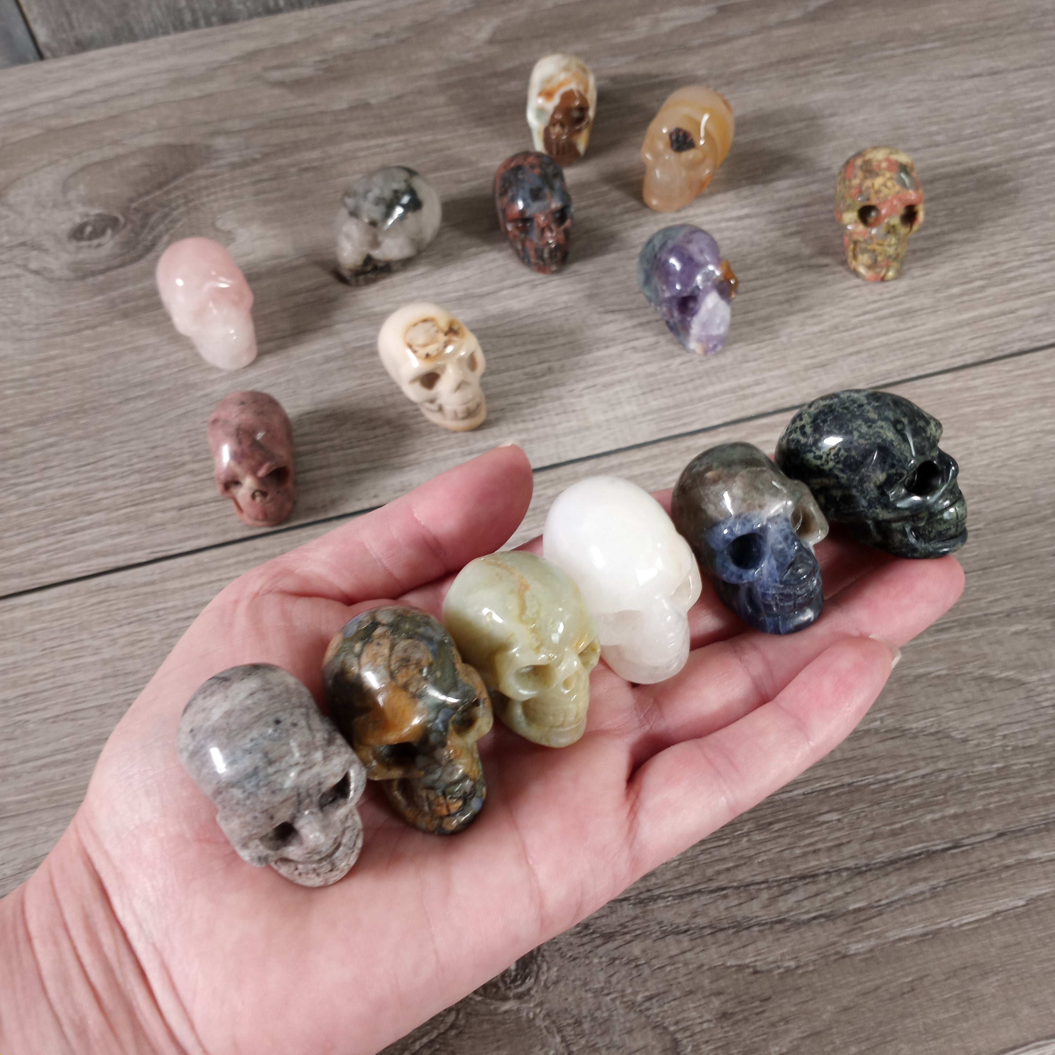 assorted gemstone skull figurines in bulk