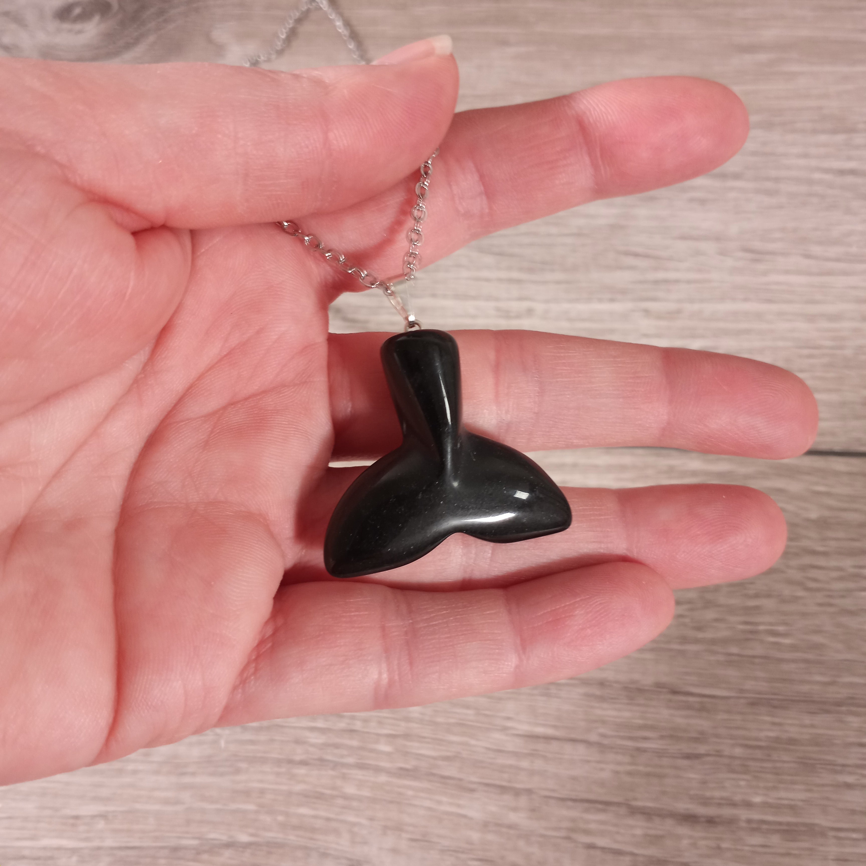 Obsidian wholesale crystal tail pendants bulk display