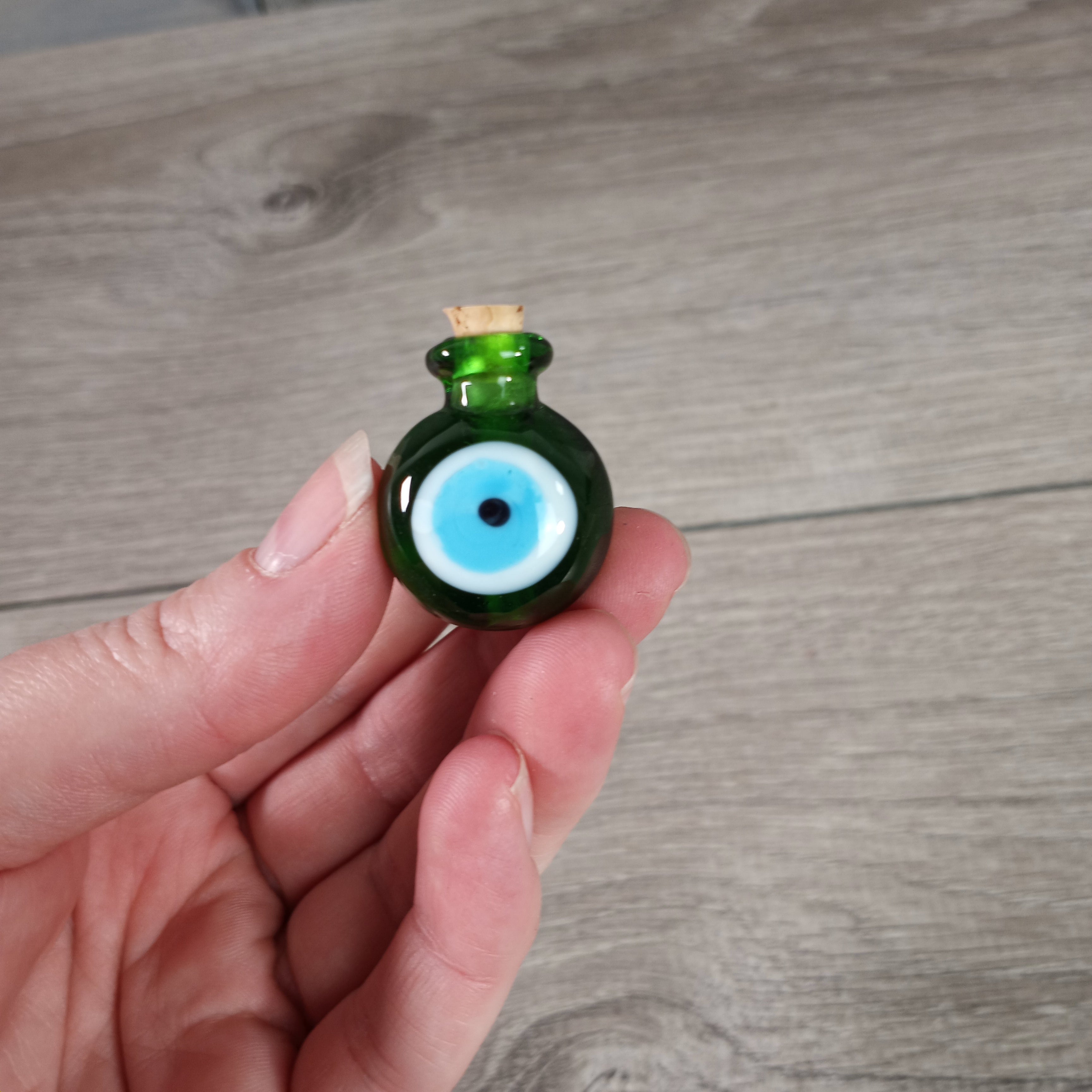 green evil eye stash bottles for metaphysical shops