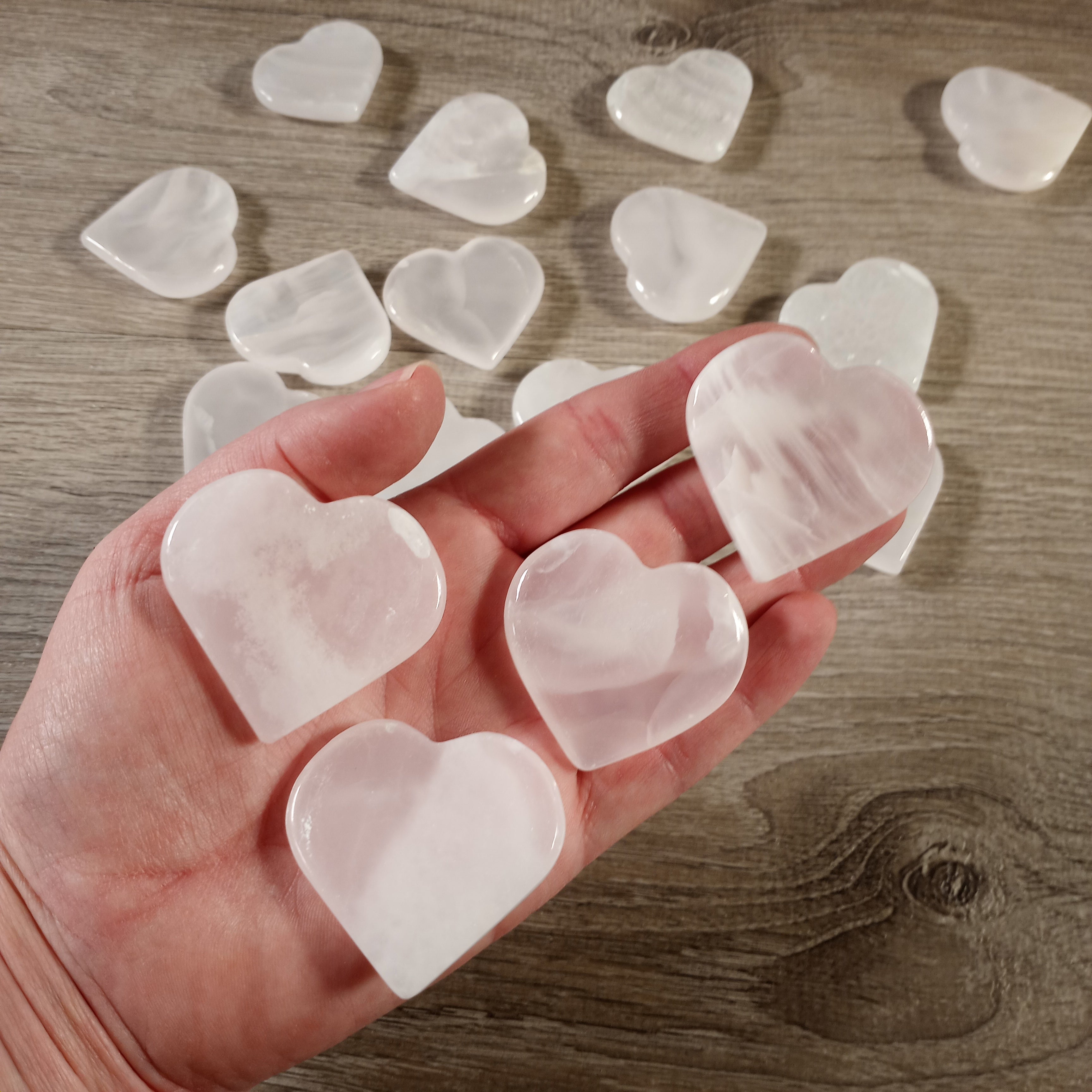 Pink calcite crystal heart worry stones for gift shops and retailers