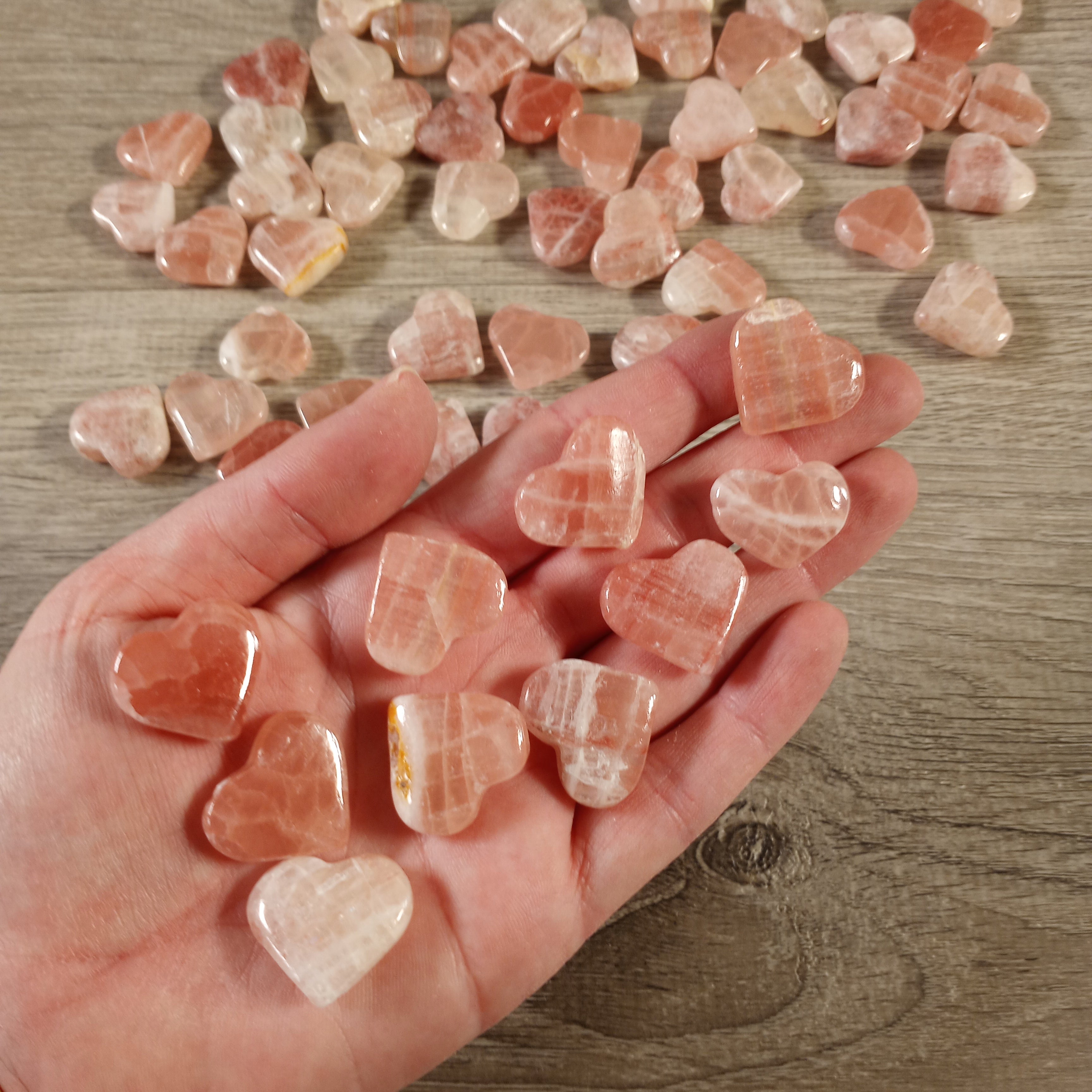 pink calcite hand carved crystal hearts for gift shops