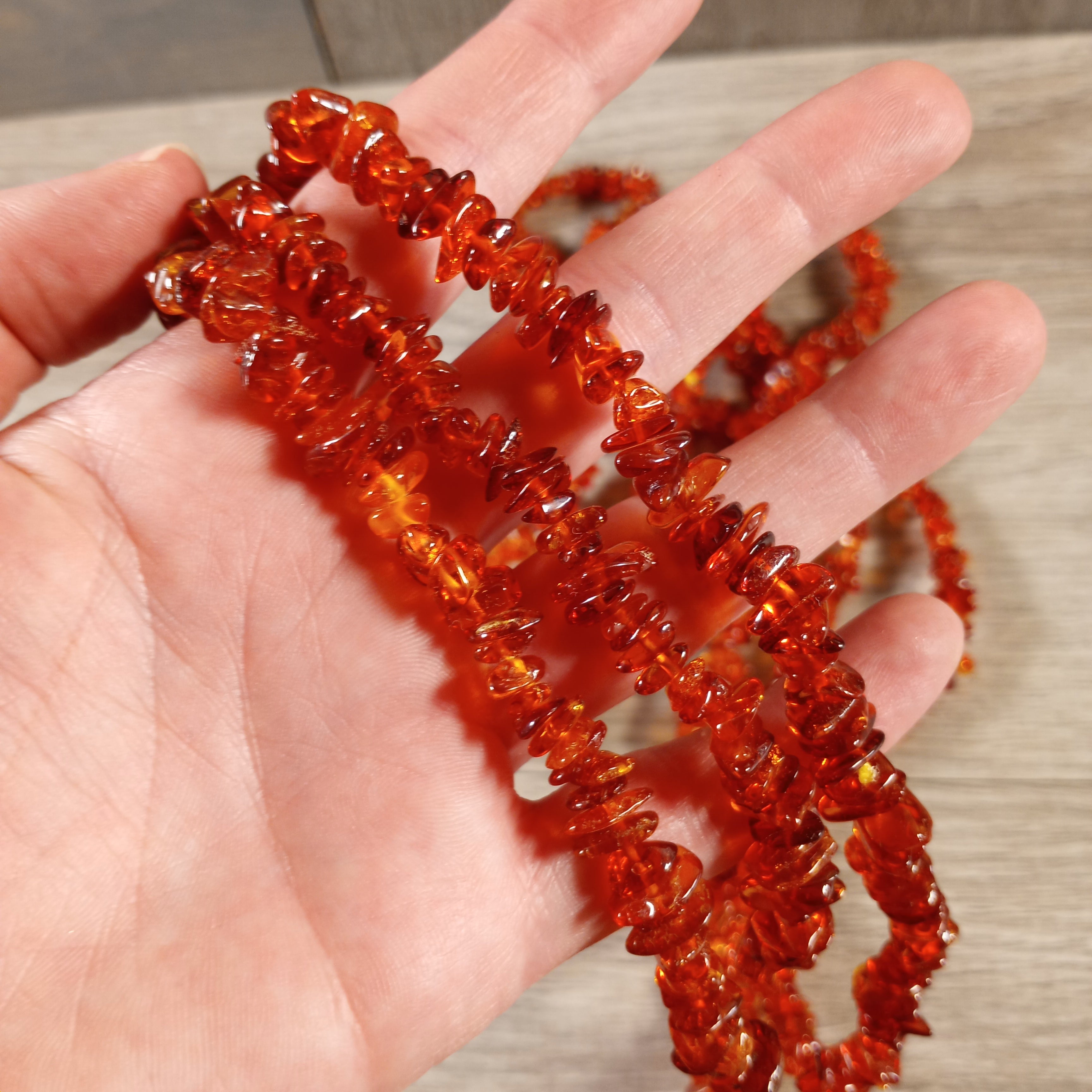 Close-up of Baltic amber chip beads strung in a necklace