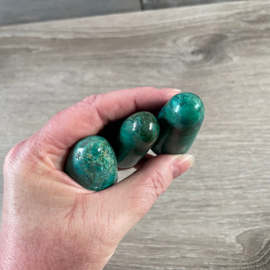 Polished blue green gemstone wand made from natural Chrysocolla