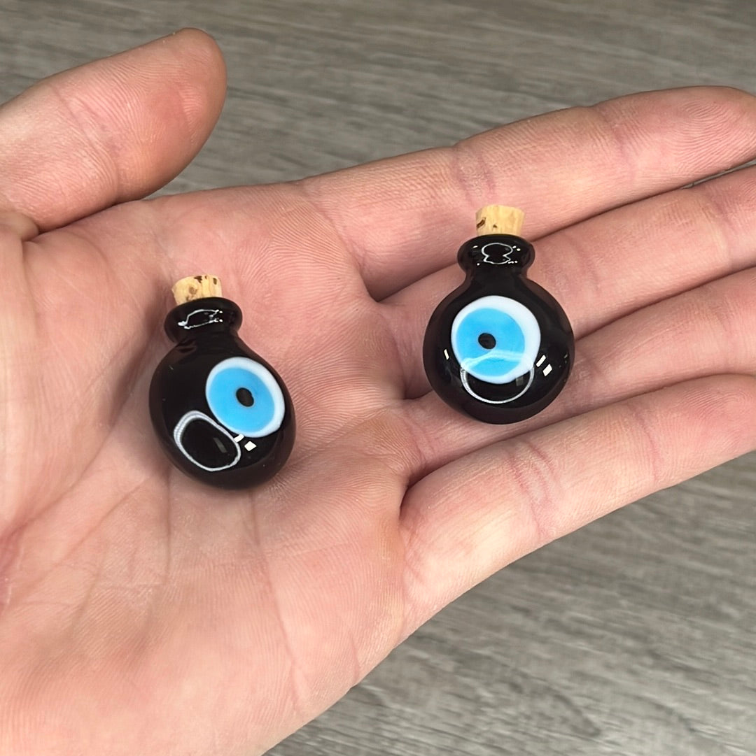 Black evil eye stash bottles for resale