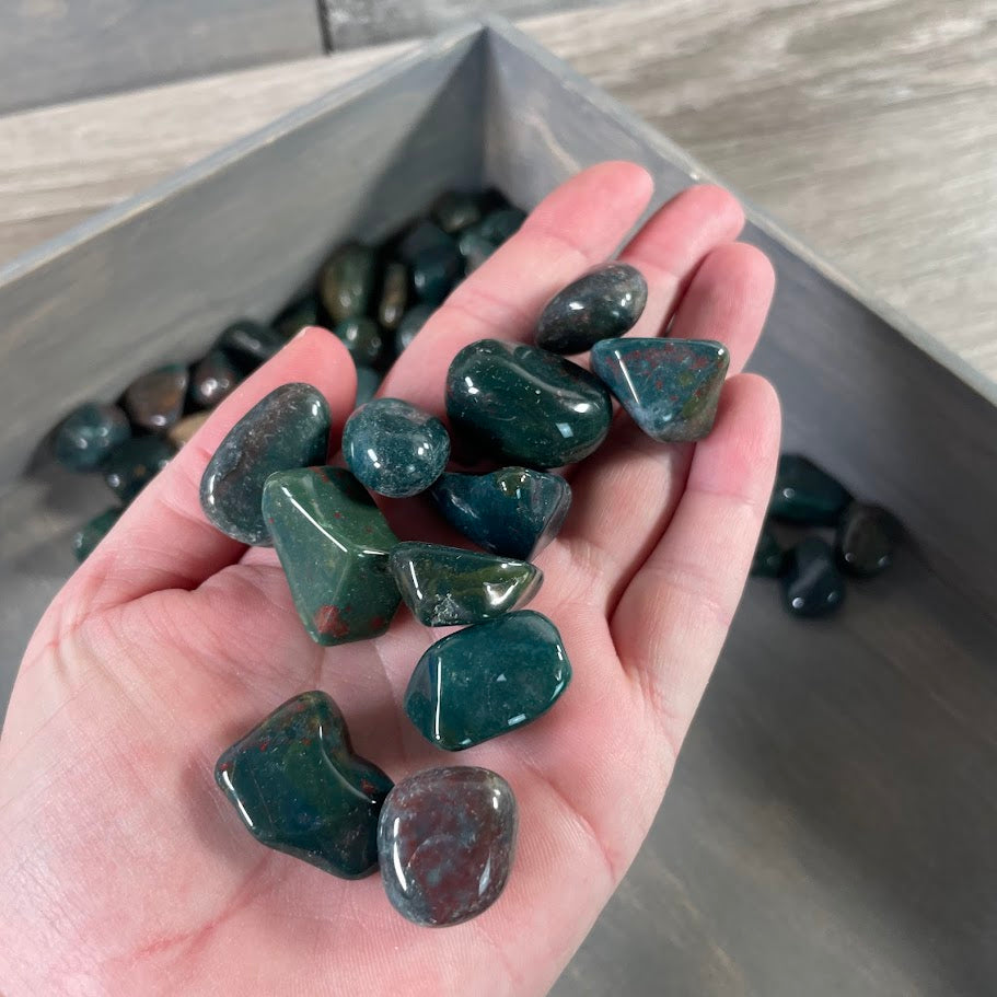 Close-up of smooth Bloodstone stones in wholesale lot from India