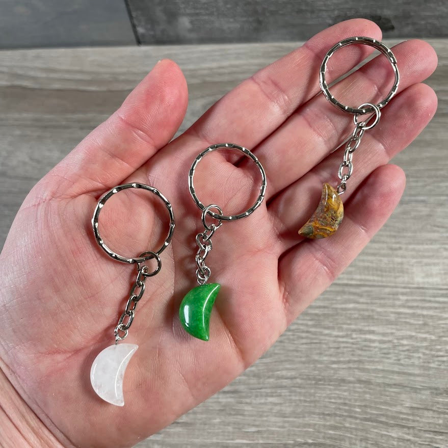 Assorted gemstone crescent moon crystal keychains with metal key rings