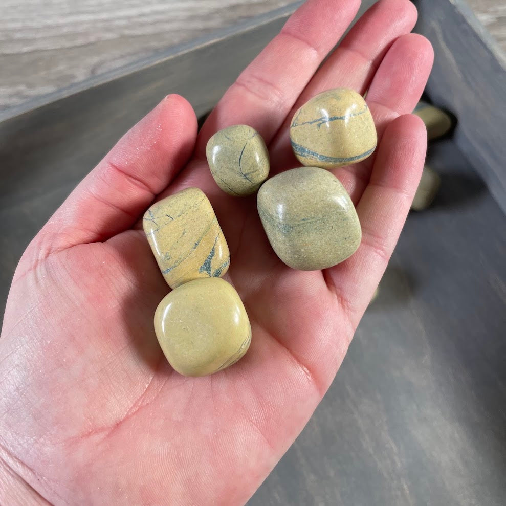 Bulk polished Banded Jasper gemstones with natural earthy banded patterns