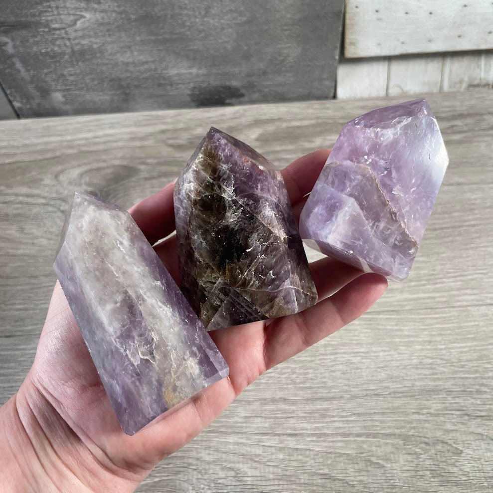 Polished Brazilian crystal obelisk towers in assorted natural gemstone colors and patterns