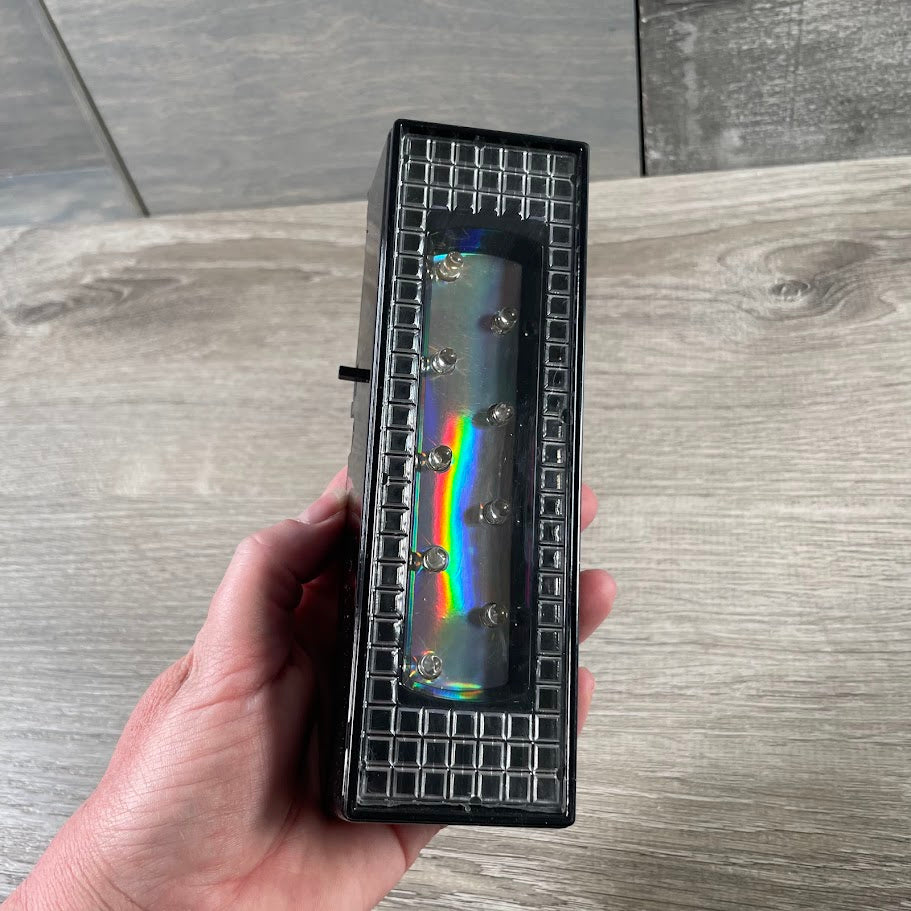 rock shop display battery powered stand