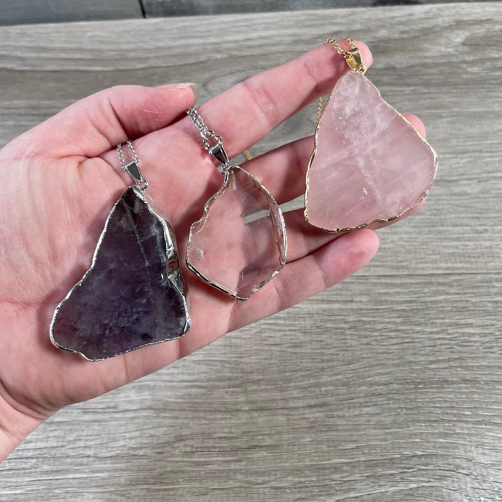 Mixed quartz electroplated slice pendants with metal edging for wholesale crystal jewelry displays