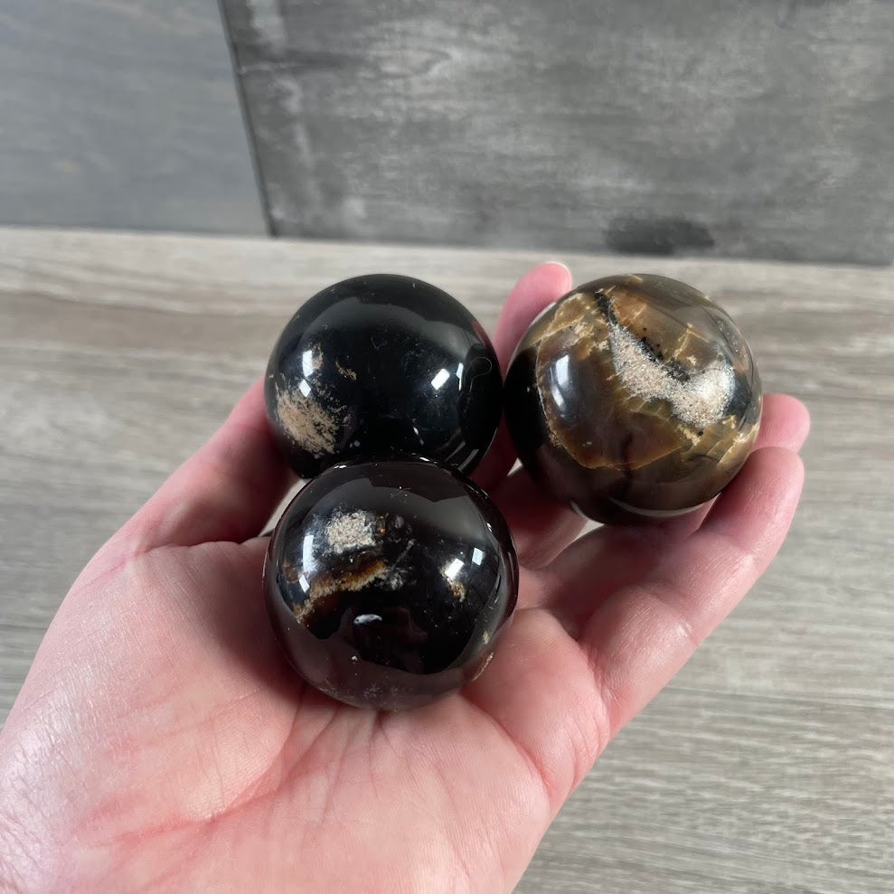Polished Black Amber sphere bulk crystal supplier