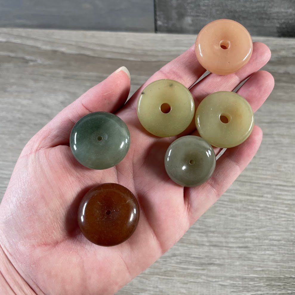 Assorted gemstone pi stone pendants for wholesale crystal shops and jewelry supply displays