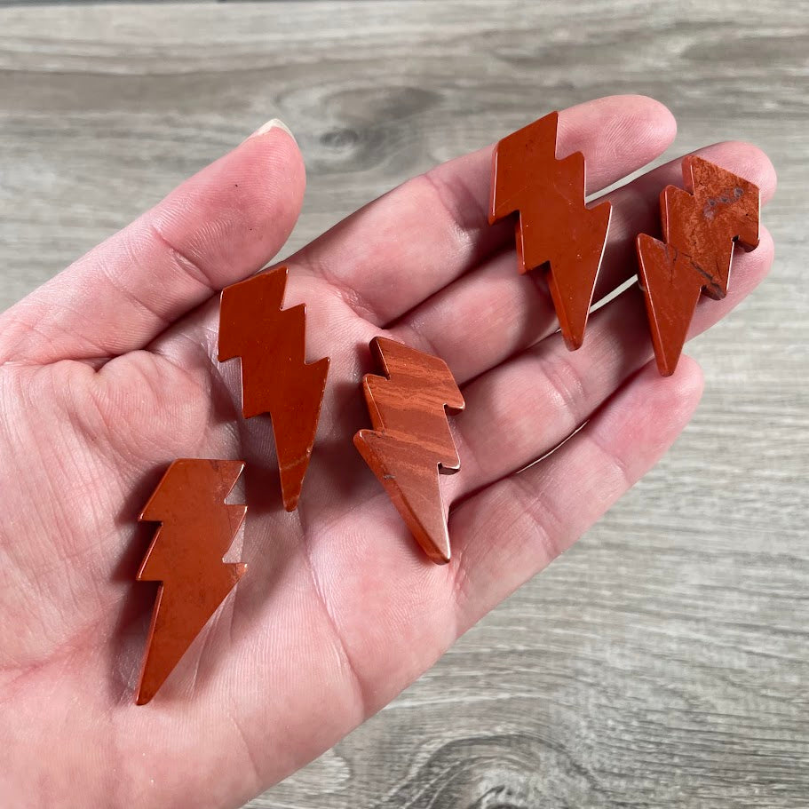 red jasper metaphysical shop supplies lightning bolt carvings