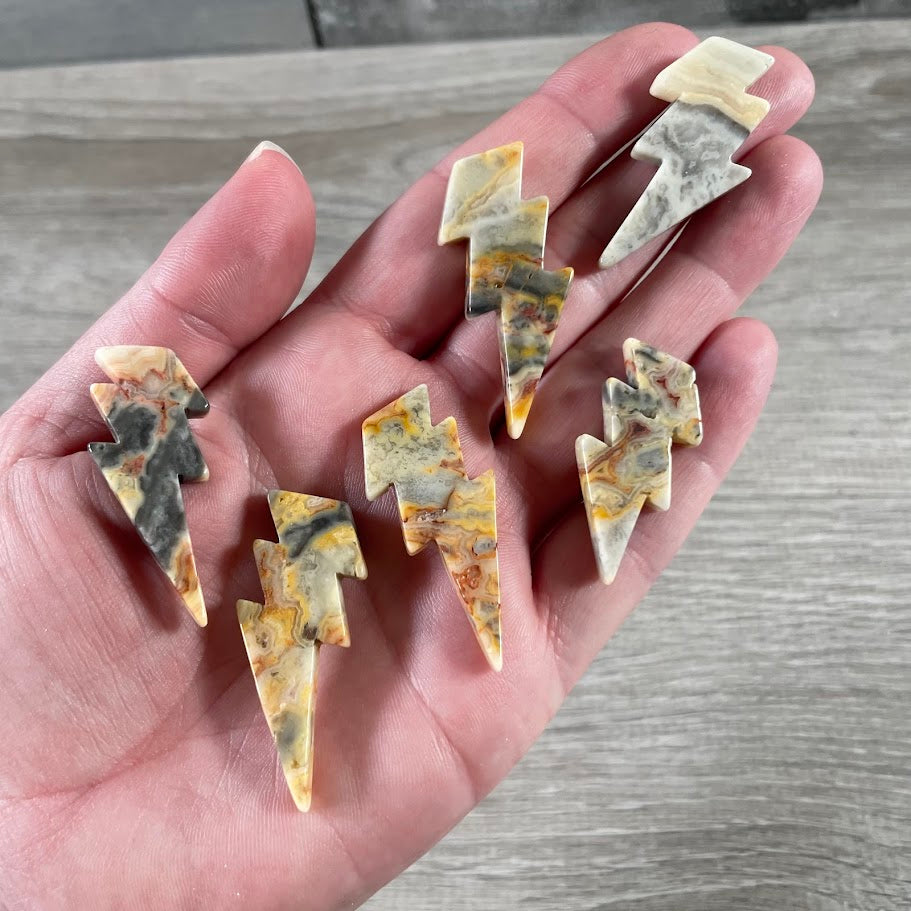 crazy lace agate energy symbol carvings, lightning bolt