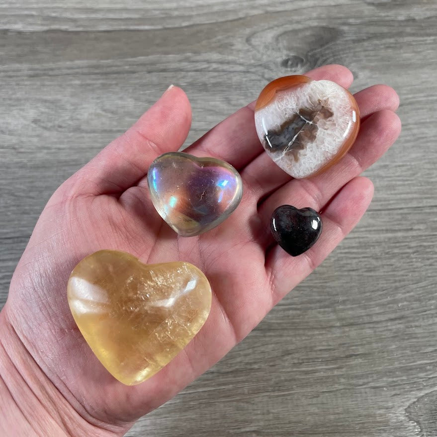 assorted gemstone heart carvings polished crystals