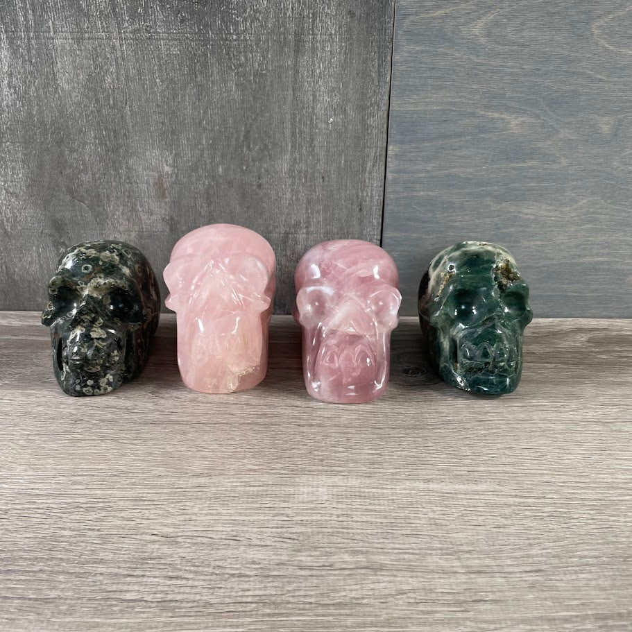 Lot of two rose quartz skulls and two Kambaba jasper skulls,for new age stores