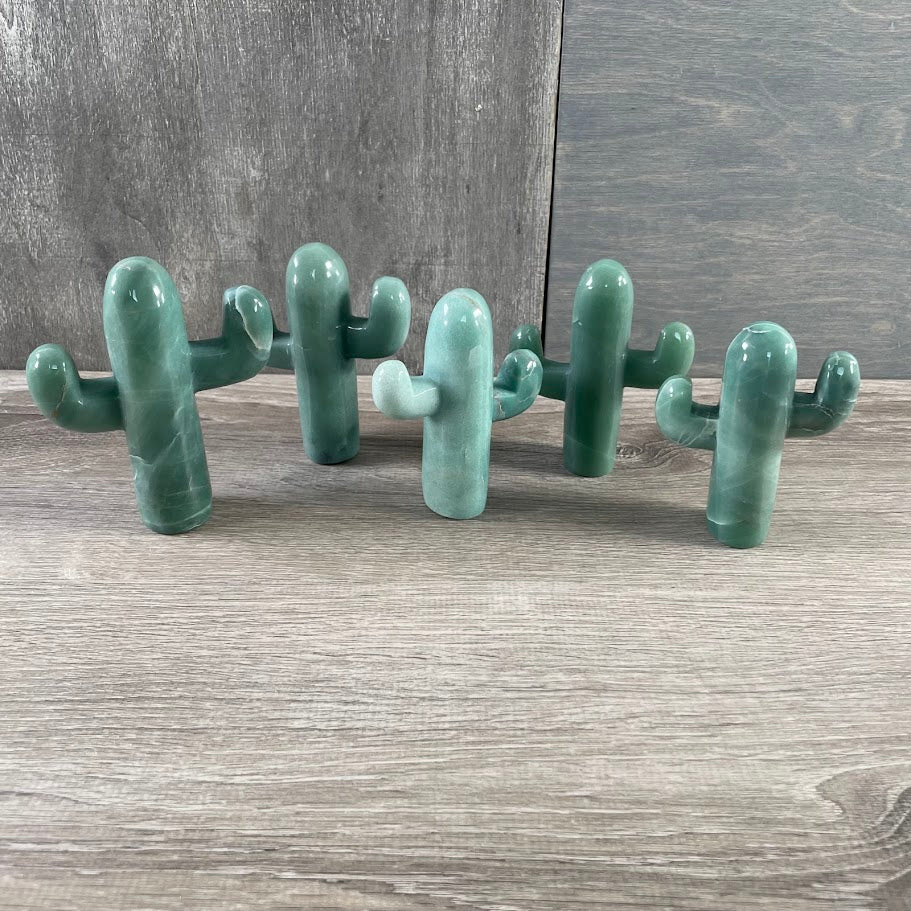 Five standing aventurine cacti.