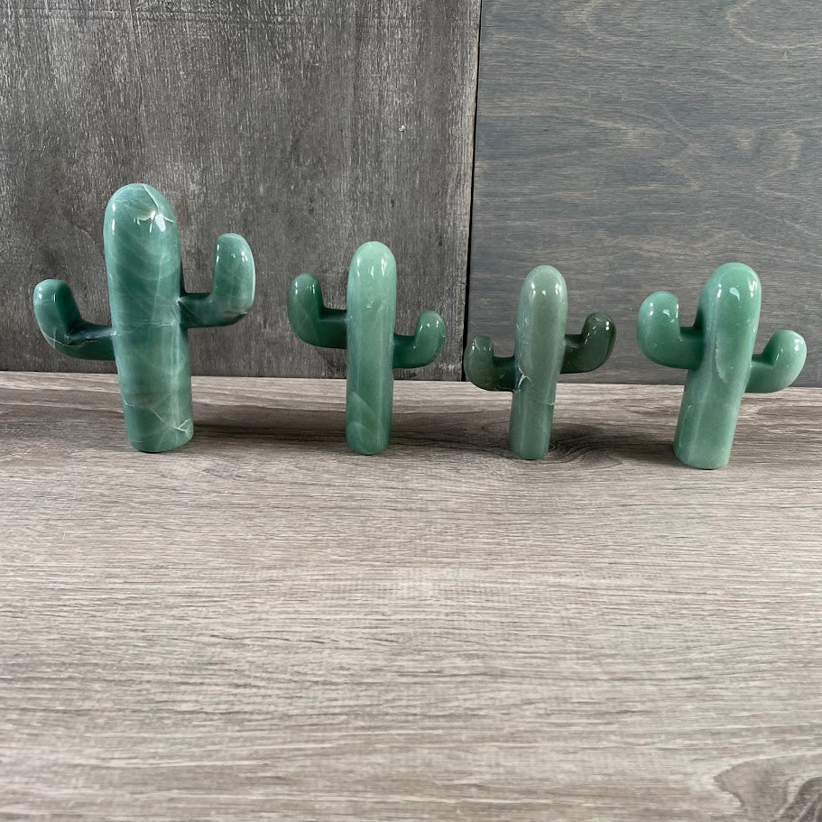 Four standing aventurine cacti.