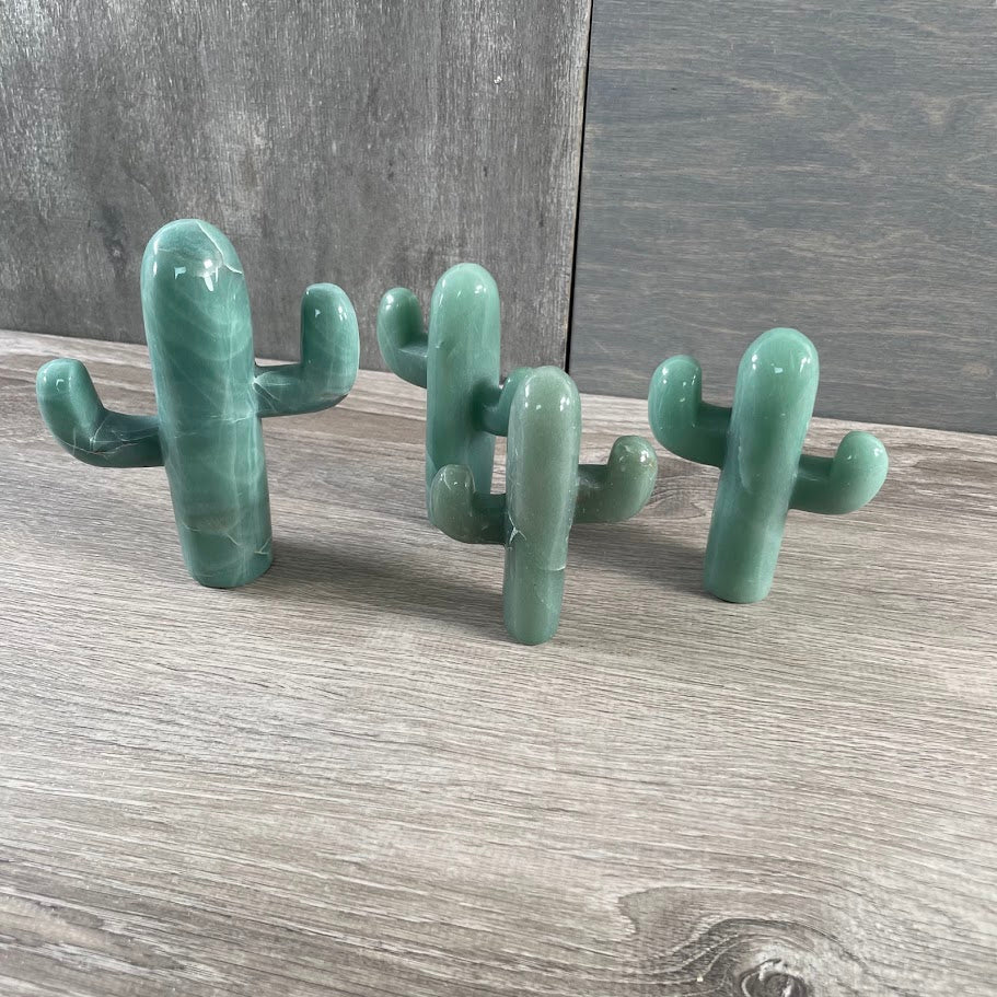 Four standing aventurine cacti.