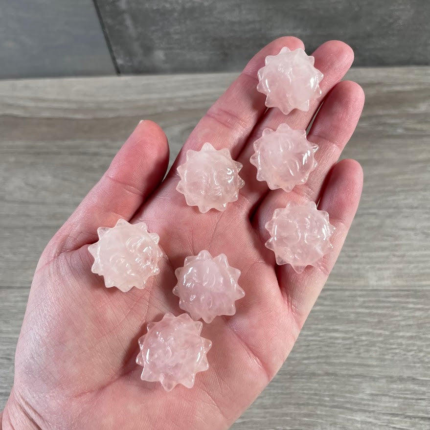 Rose Quartz crystal sun face carvings for gift shops, boutiques, and spiritual stores