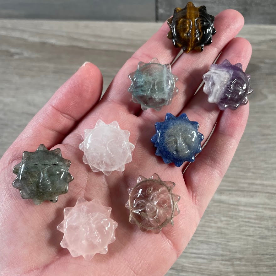 Assorted sun face gemstone carvings for metaphysical shops and crystal displays