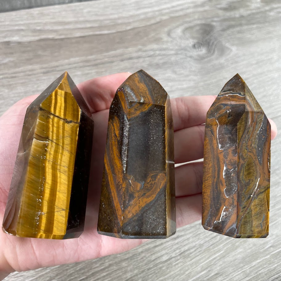 Tiger eye stone crystal points in obelisk shapes for wholesale resale and shop inventory