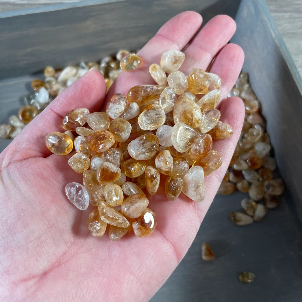 Small polished Citrine gemstones sold by the pound for metaphysical boutiques