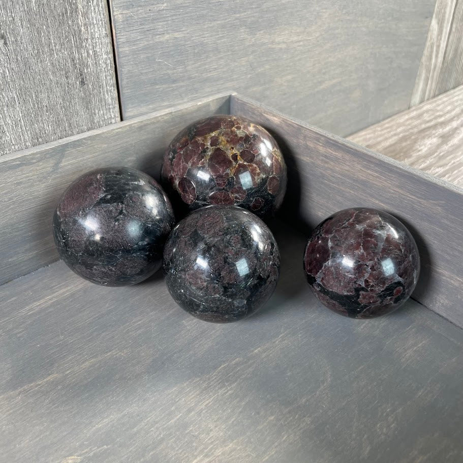 Astrophyllite spheres for resale.