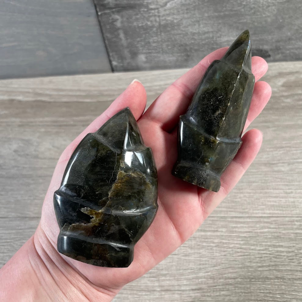 Polished labradorite fleur-de-lis shaped stone with natural blue and green flash
