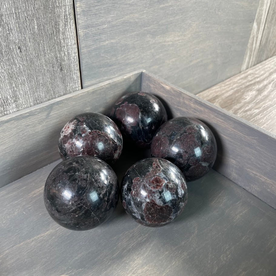 Astrophyllite with garnet spheres perfect for alters.