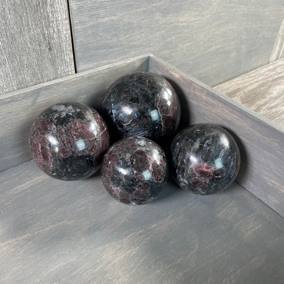 Astrophyllite with garnet spheres for gift shops.