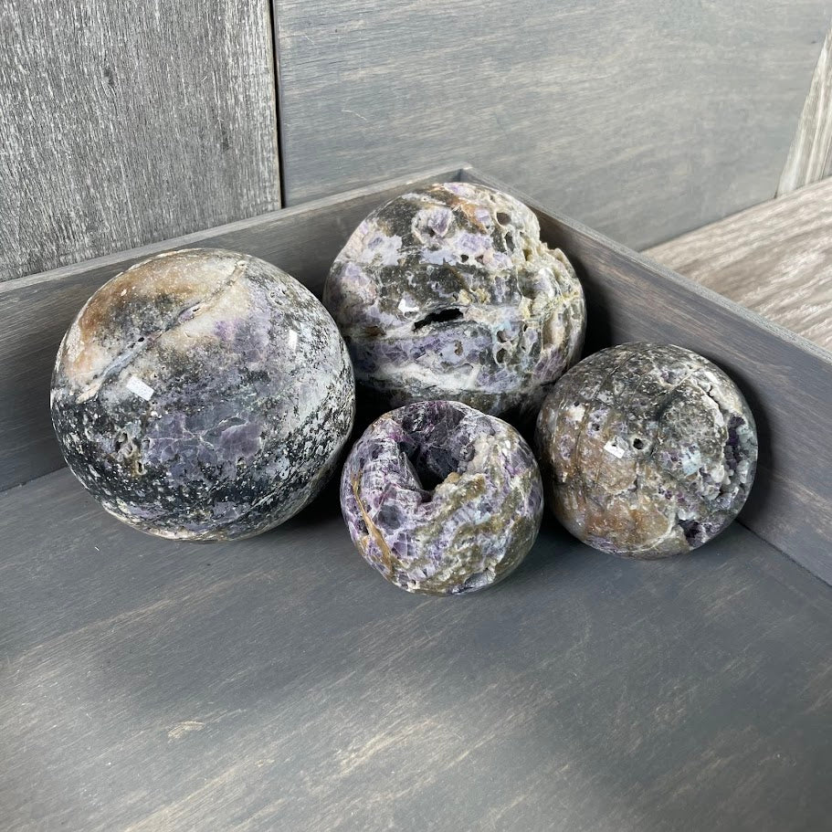 Lot of four fluorite vug spheres, wholesale