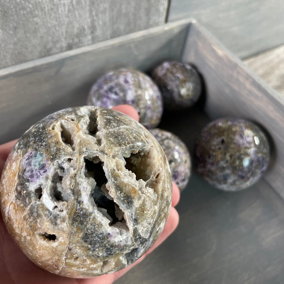 Lot of five fluorite vug spheres; for crystal shops
