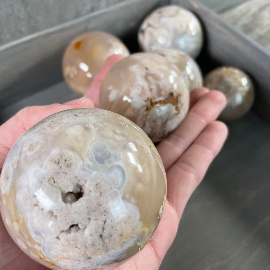 Lot of seven flower agate spheres; bulk purchase