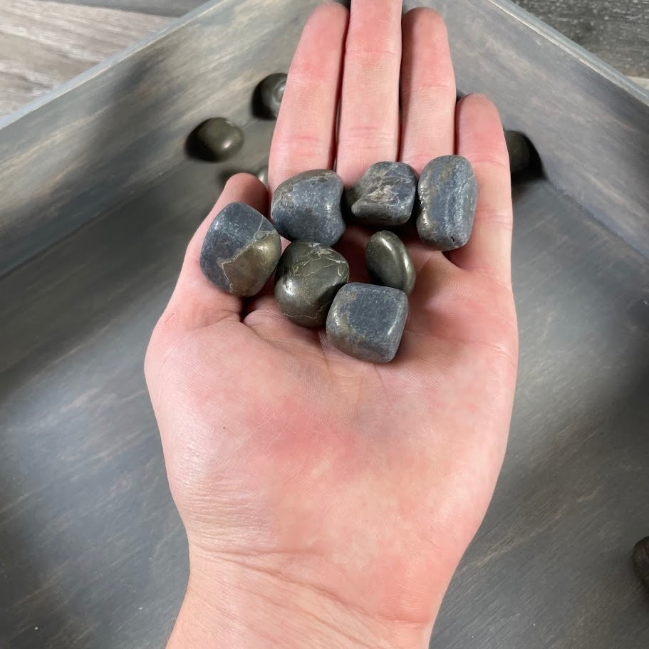 Pyrite crystal tumbled stones displayed in retail bowl – wholesale lot for resale