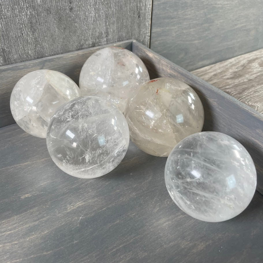 Lot of five quartz spheres.