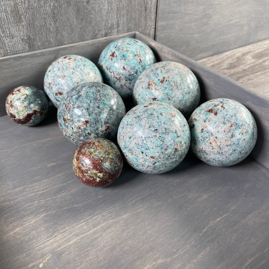 Amazonite with biotite spheres from Brazil, wholesale.