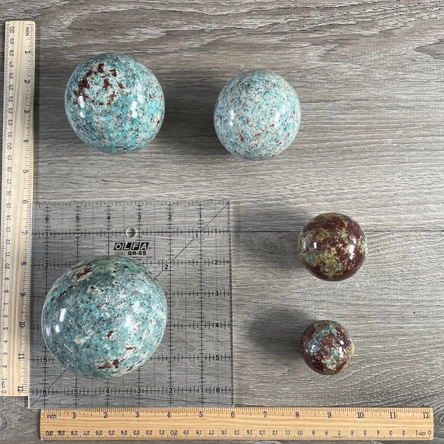 Lot of five amazonite with biotite spheres